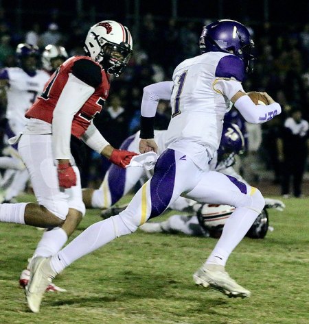 The Tigers' Johnny Cunha runs for a long gain in the first half of Friday night's WYL season finale.